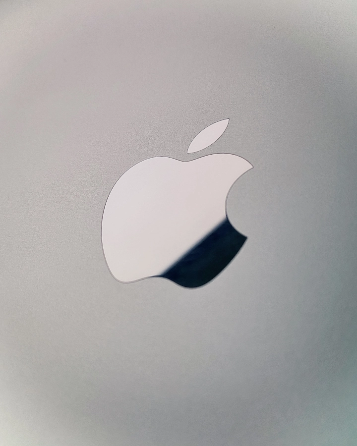 Silver apple logo on a laptop symbolizing brand awareness