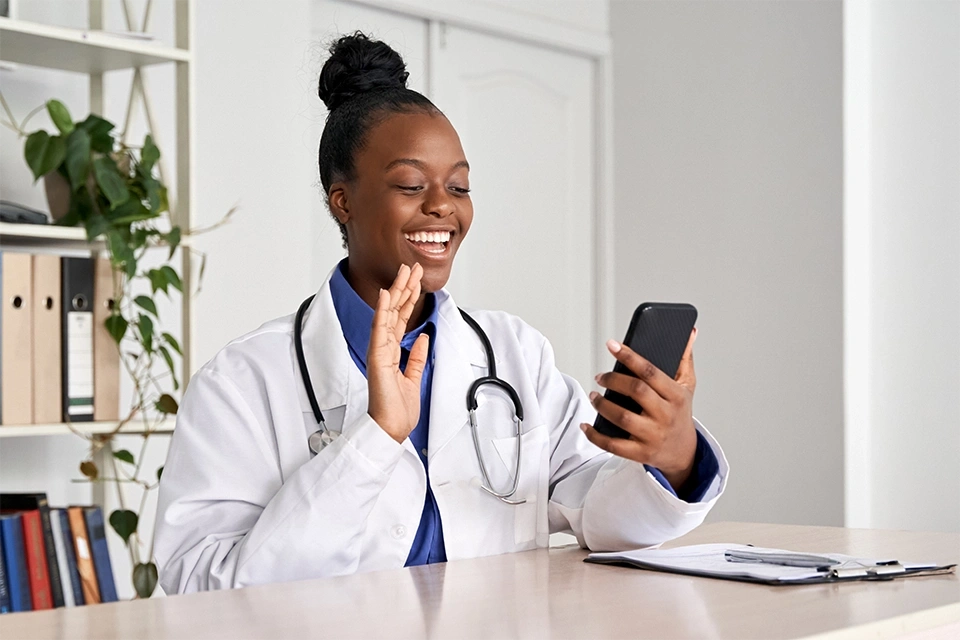 healthcare influencer waving hi to her phone