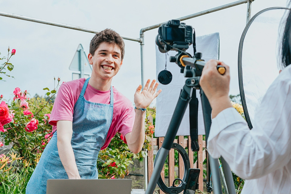 a good influencer making a video in an apron
