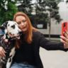 Woman taking a selfie with a dalmatian