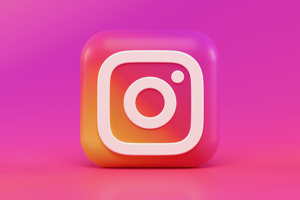 Large Instagram icon on a pink background