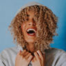 Woman with curly hair laughing