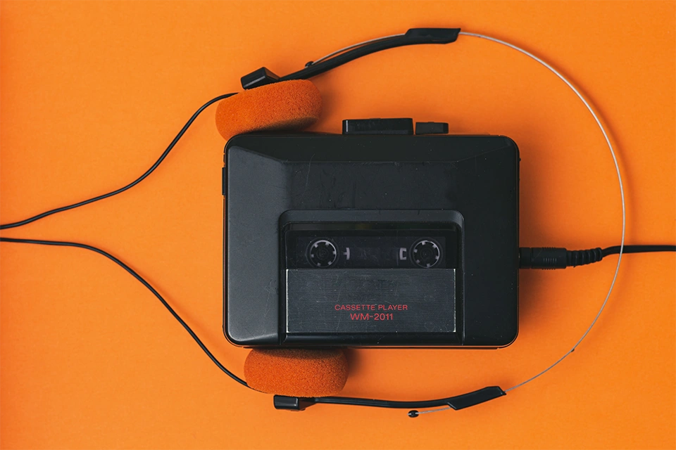 an old cassette player and headphones for use in nostalgia marketing