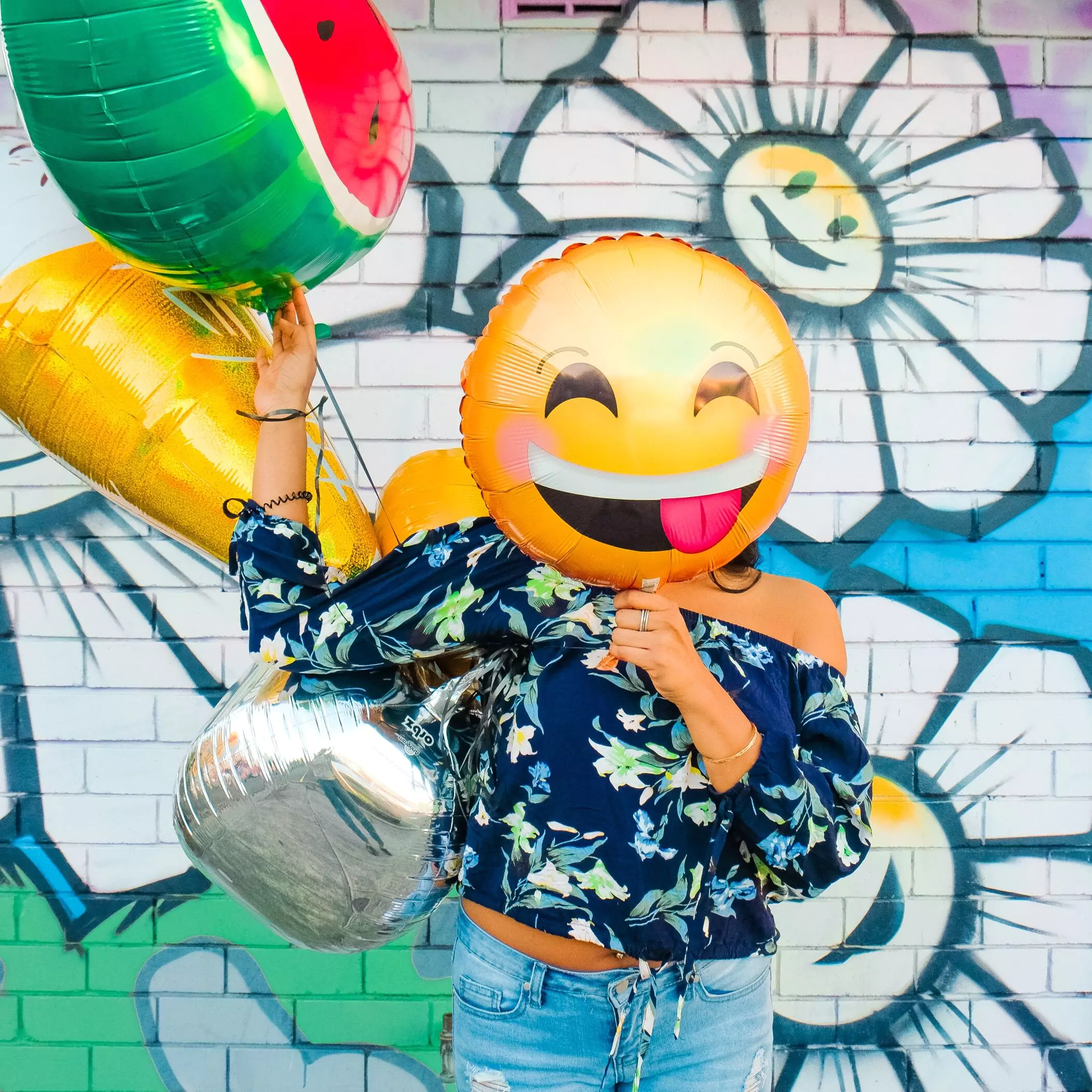 influencer with emoji balloons