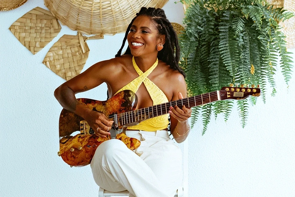 Smiling woman with a guitar