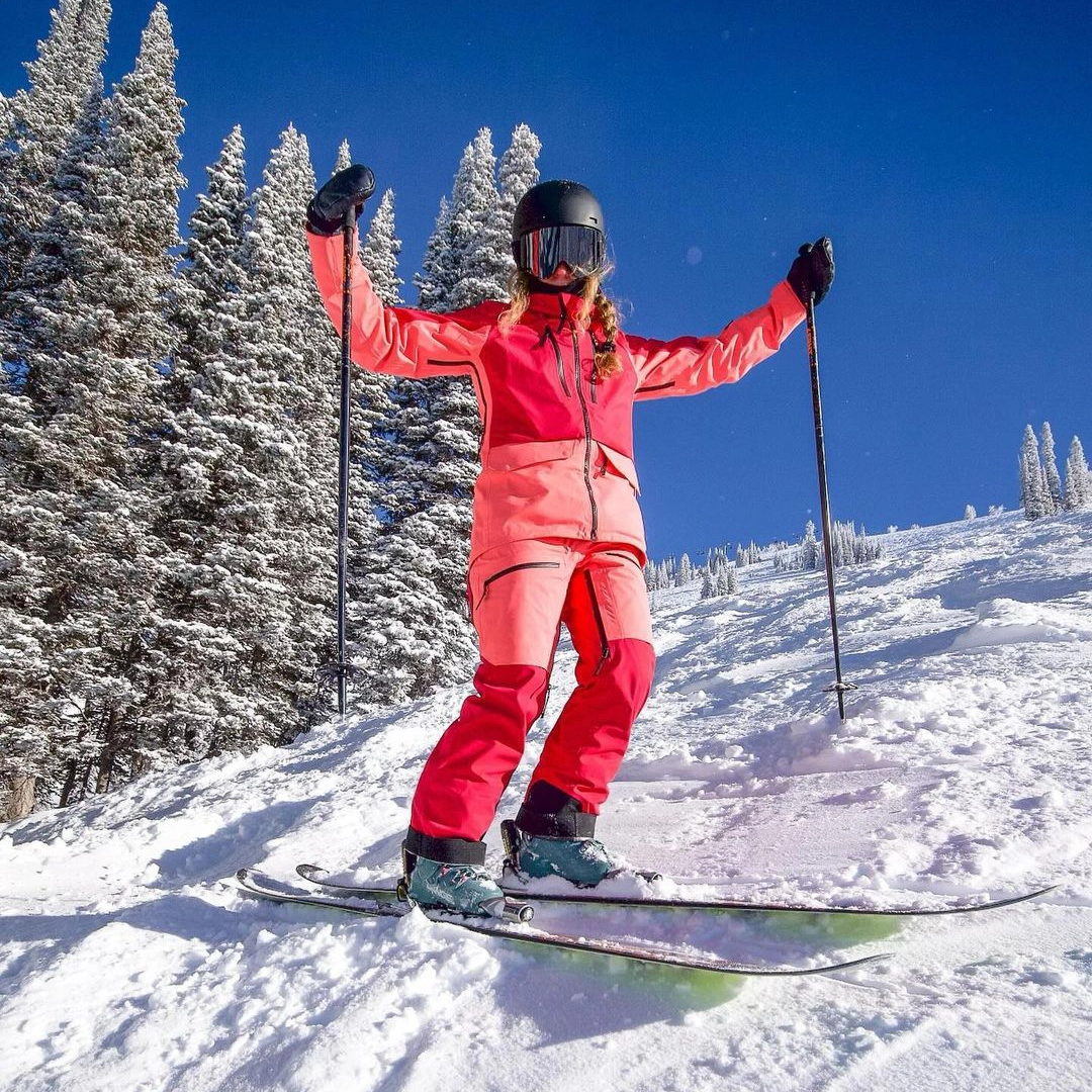 Person skiing in a bright ski suit