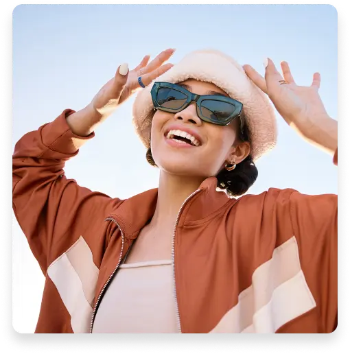 A woman with glasses and a hat